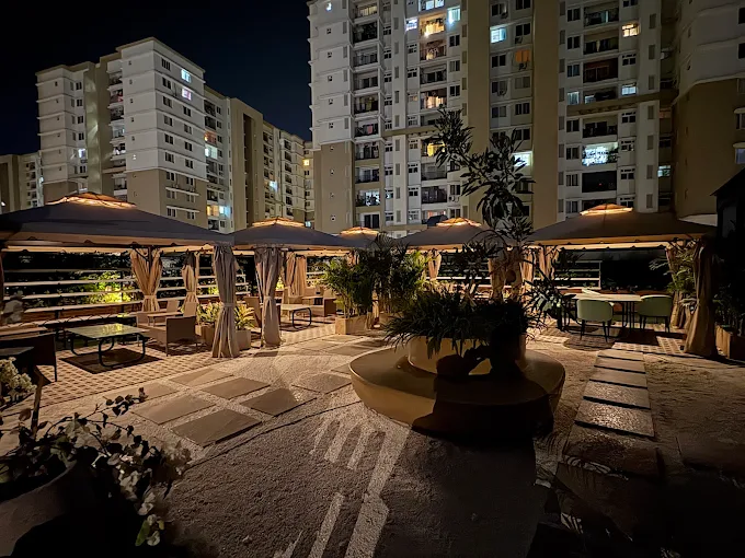 The rooftop courtyard at Stories Brew Garden, Avalahalli, Yelahanka, lit at night